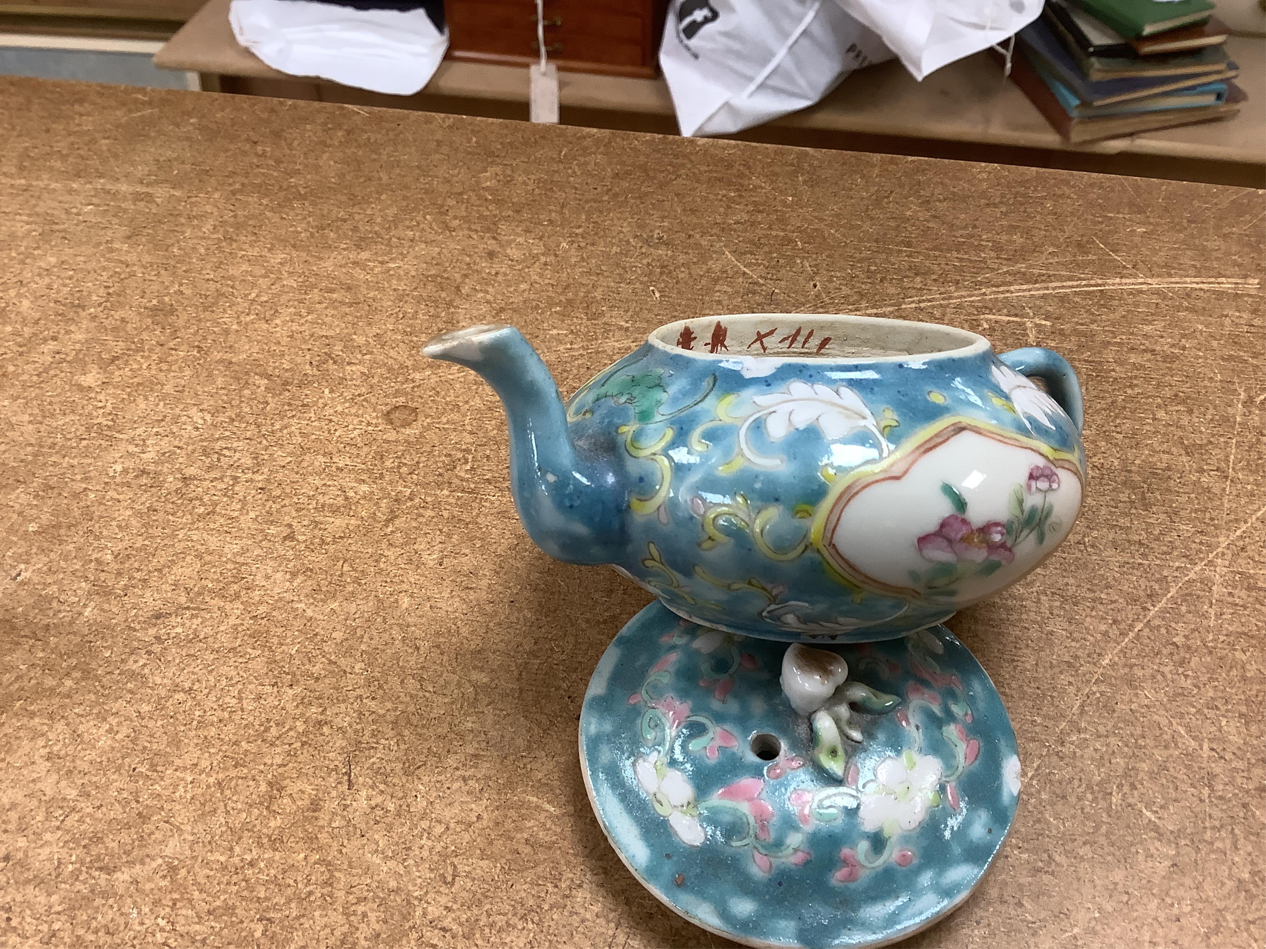 Two Chinese blue ground teapots, Tongzhi mark, and a pair of orange ground bowls and covers, teapots 15cm wide. Condition - fair